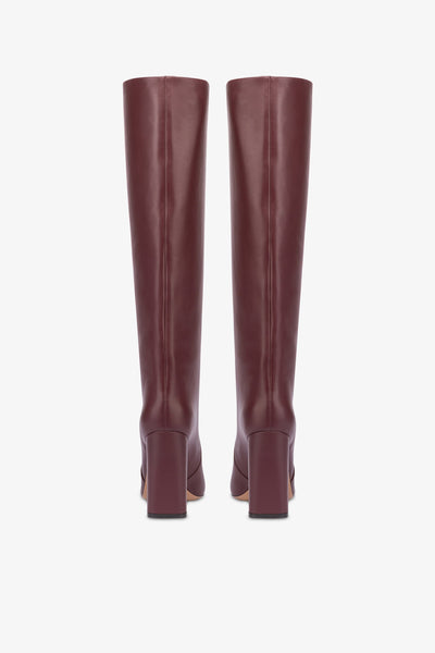 Knee-high boots in smooth burgundy leather