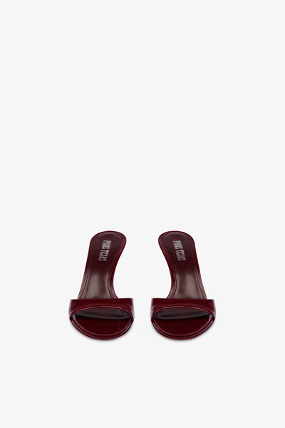 Almond-toe mules in patent rouge noir leather