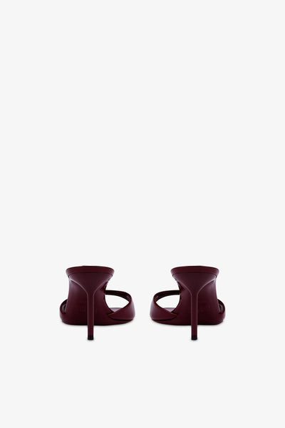 Almond-toe mules in patent rouge noir leather