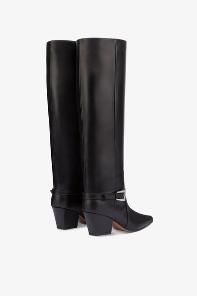 Long, pointed knee-high boots in smooth black leather