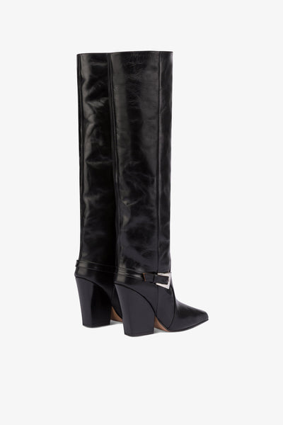 Tall, knee-high boots in shiny black vintage leather