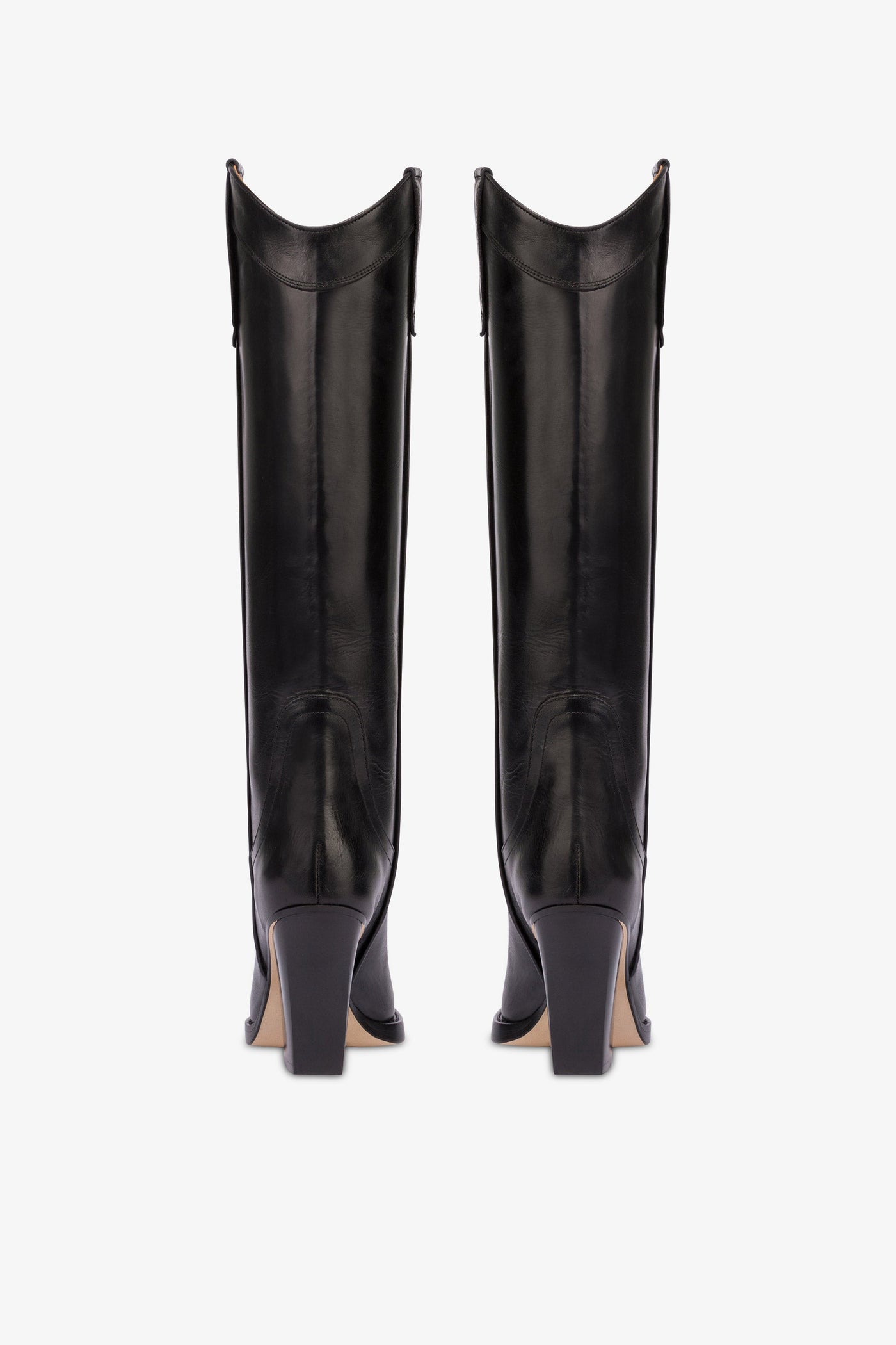 Pointed knee-high boots in black shiny vintage leather